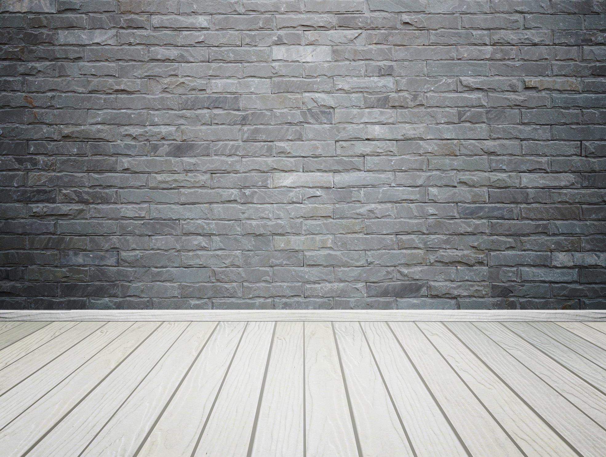 room interior with brick stone tiles wall and wood floor